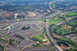 Aerial view of the United States Pentagon, the Department of Defense headquarters in Arlington, Virginia, near Washington DC, with I-395 freeway and the Air Force Memorial and Arlington Cemetery nearby.