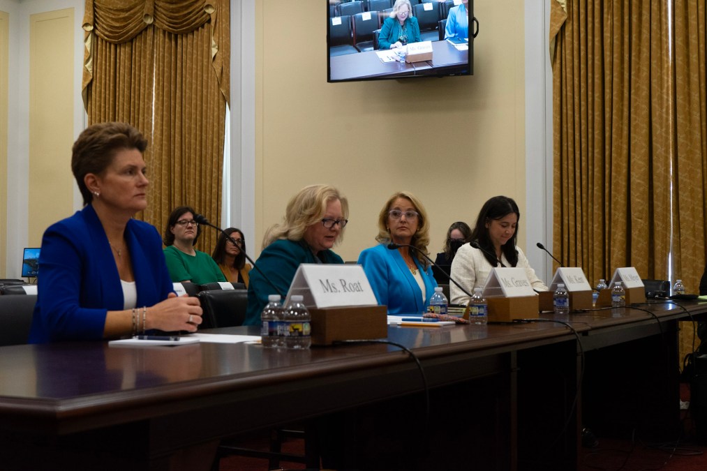 Maria Roat, Margie Graves, Suzette Kent and Erie Meyer sit at a long table in a hearing room on Capitol Hill.