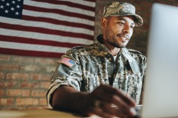 U.S. soldier working at workstation.